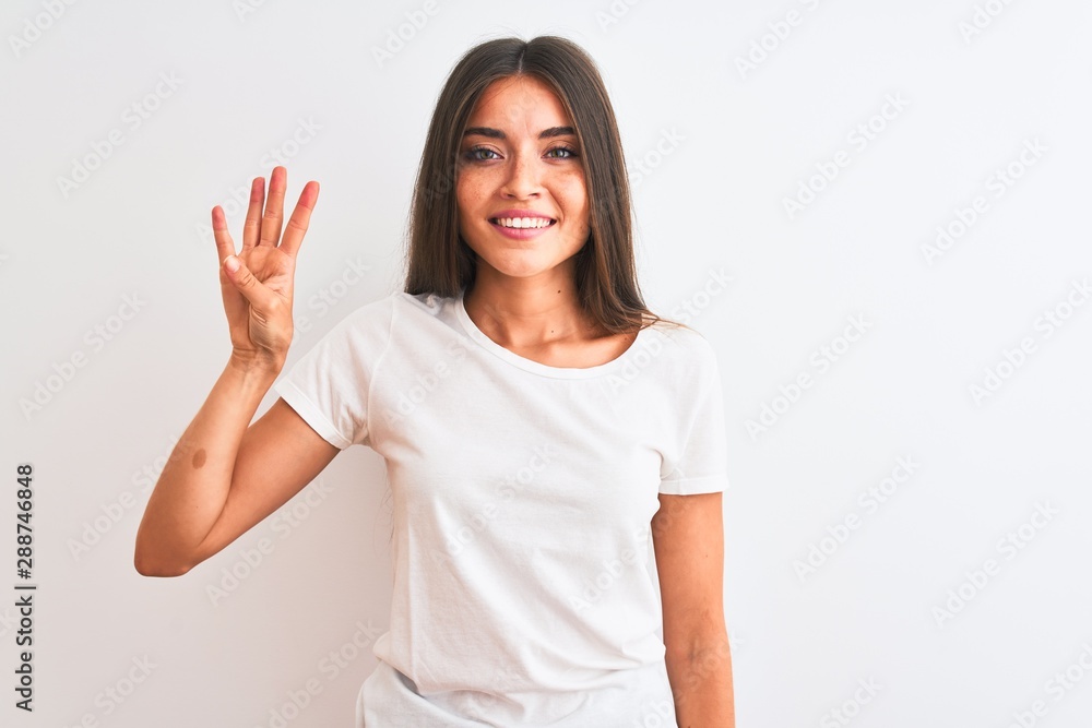 Young beautiful woman wearing casual t-shirt standing over isolated white background showing and pointing up with fingers number four while smiling confident and happy. Young beautiful woman wearing casual t-shirt standing over isolated white background showing and pointing up with fingers number four while smiling confident and happy.