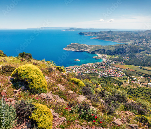 Colorful morning view of Paralia Kakis Thalassis village. Bright spring seascape of Aegean sea. Sunny morning scene of the Greece, Europe. Beauty of nature concept background.