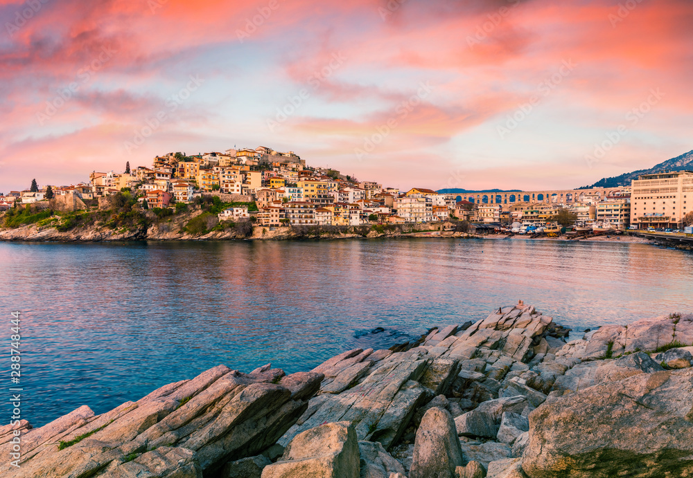 Fantastic spring seascape of Aegean Sea. Great sunrise in Kavala city, Macedonia, Greece, Europe. Traveling concept background. Artistic style post processed photo.