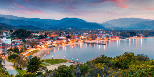 Picturesque spring scene of Aegean sea. Dramatic sunset of Olimpiada town, Greece, Europe. Traveling concept background. Active tourism concept background.