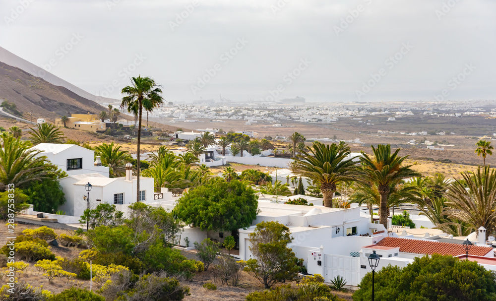 Typical Canarian village or town with white houses and volcanic landscape, Nazaret, Lanzarote island, Canary, Spain
