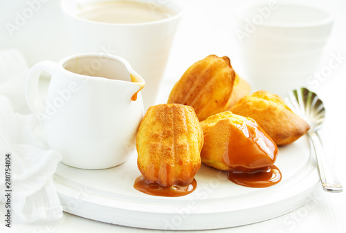 Madeleine french cookies with caramel. selective focus.