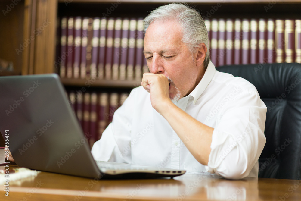 Tired business man yawning Tired business man yawning