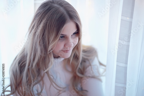 cute blonde sweater portrait / winter look, portrait of beautiful model with long hair in cold season