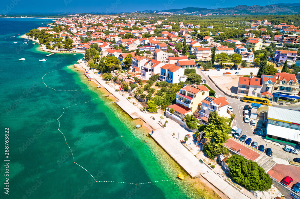 Brodarica village near Sibenik beach and coastline aerial view