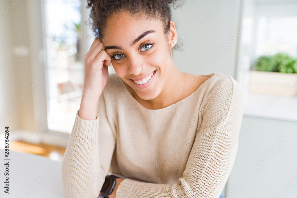 Beautiful young african american woman smiling friendly with crossed arms looking at the camera with big smile