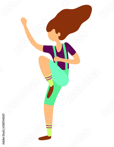 girl with long hair in overalls jumps and dances
