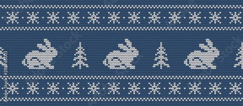 Christmas background. Knitted pattern with hares and christmas trees on a blue background. Ornament. Seamless border. Vector illustration