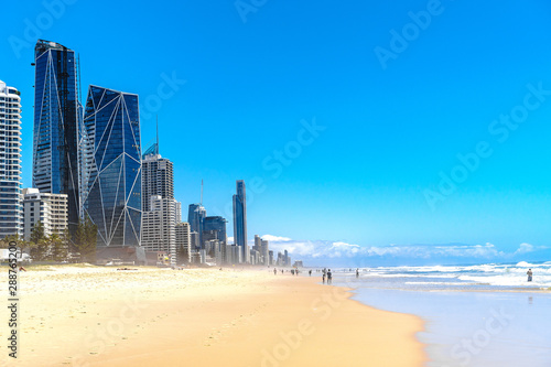 Beautiful wide panoramic view of the Gold Coast skyline and Surfers Paradise beach with rolling waves of Pacific ocean.