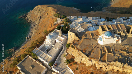 Aerial drone photo of iconic medieval fortified castle overlooking the deep blue Aegean sea in Chora of Astypalaia island, Dodecanese islands, Greece photo