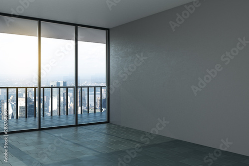 Blank grey mock up wall in modern office hall with concrete floor, big window and city view.