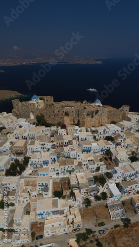 Aerial drone photo of iconic medieval fortified castle overlooking the deep blue Aegean sea in Chora of Astypalaia island, Dodecanese islands, Greece © aerial-drone