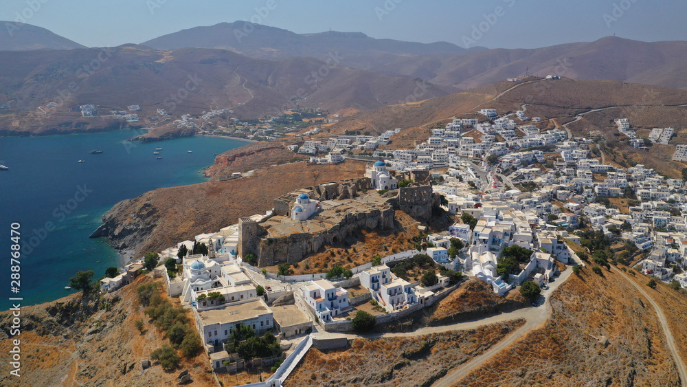 Aerial drone photo of iconic medieval fortified castle overlooking the deep blue Aegean sea in Chora of Astypalaia island, Dodecanese islands, Greece Aerial drone photo of iconic medieval fortified castle overlooking the deep blue Aegean sea in Chora of Astypalaia island, Dodecanese islands, Greece