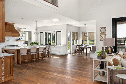 Living Room, Kitchen, and Eating Nook in New Luxury Home with Open Concept Floor Plan photo