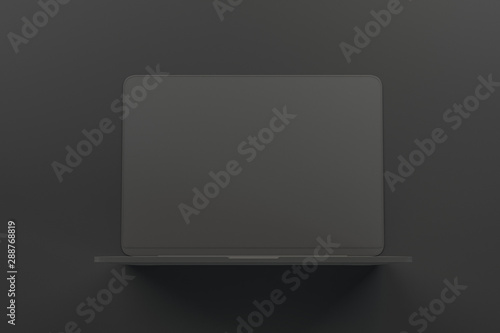 All black minimal concept with onepiece single material black laptop at abstract dark background.