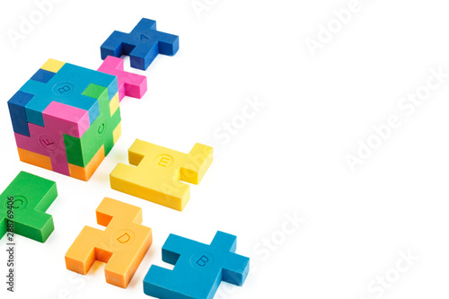 Cube puzzle of multi-colored rubber shapes. Concept of decision making process, creative, logical thinking. Logical tasks.