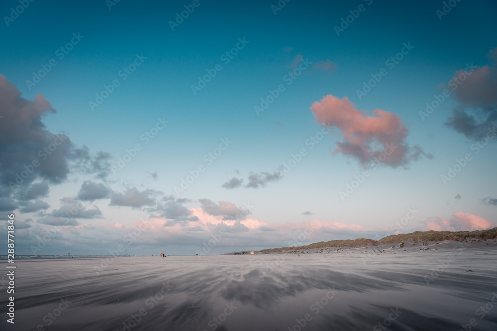 Beach landscape, sunset at the beach, beautiful blue cloudy sky, orange sky, contrast, light, shadow, idyllic, sand winds, Dutch north sea, coast, Wadden island, Friesland, the Netherlands