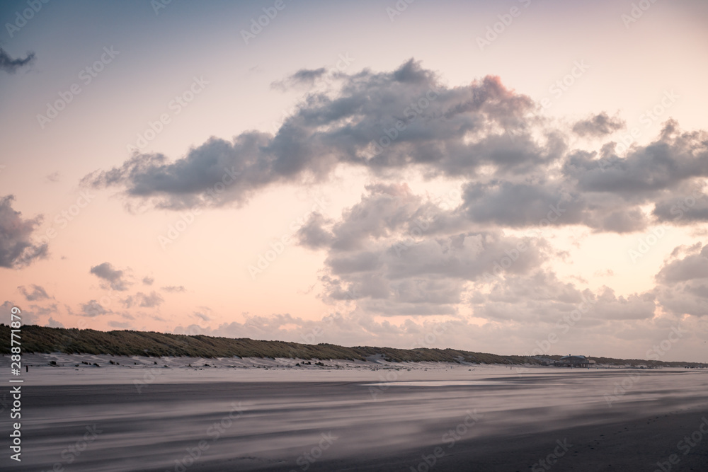 Beach landscape, sunset at the beach, beautiful blue cloudy sky, orange sky, contrast, light, shadow, idyllic, sand winds, Dutch north sea, coast, Wadden island, Friesland, the Netherlands