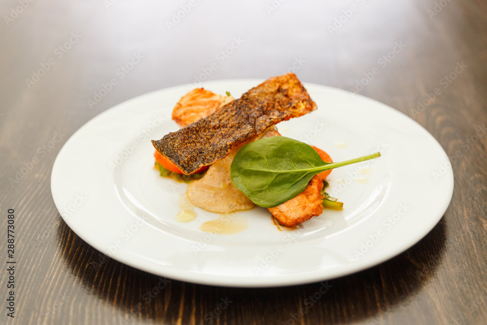 Salmon steak with creamy sauce and vegetables Salmon steak with creamy sauce and vegetables