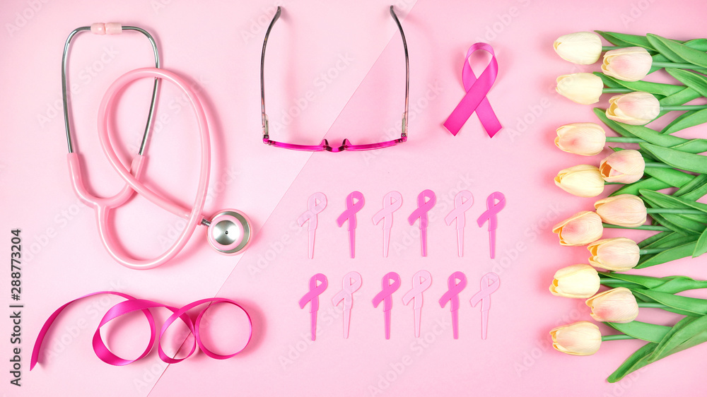 Pink Ribbon Breast Cancer Awareness Month concept flat lay on pink background. Pink Ribbon Breast Cancer Awareness Month concept flat lay on pink background.