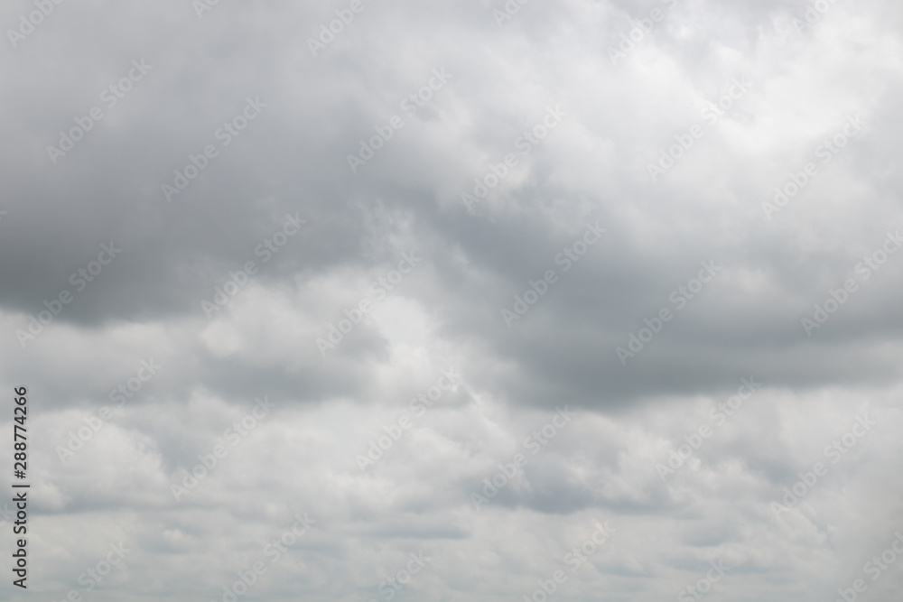 Fluffy white clouds covered the sun and sky during the day Fluffy white clouds covered the sun and sky during the day