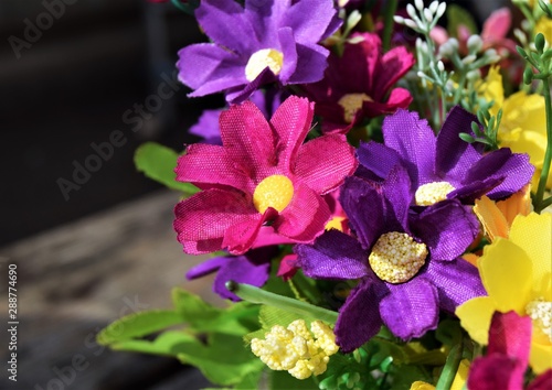 Fake purple flowers close up