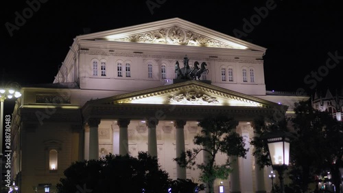 Beautiful vintage facade of the Bolshoi Theater Moscow. Building was built in 1776. Famous attraction. Night Time, view of the main entrance which is decorated with stucco molding and stunning statues