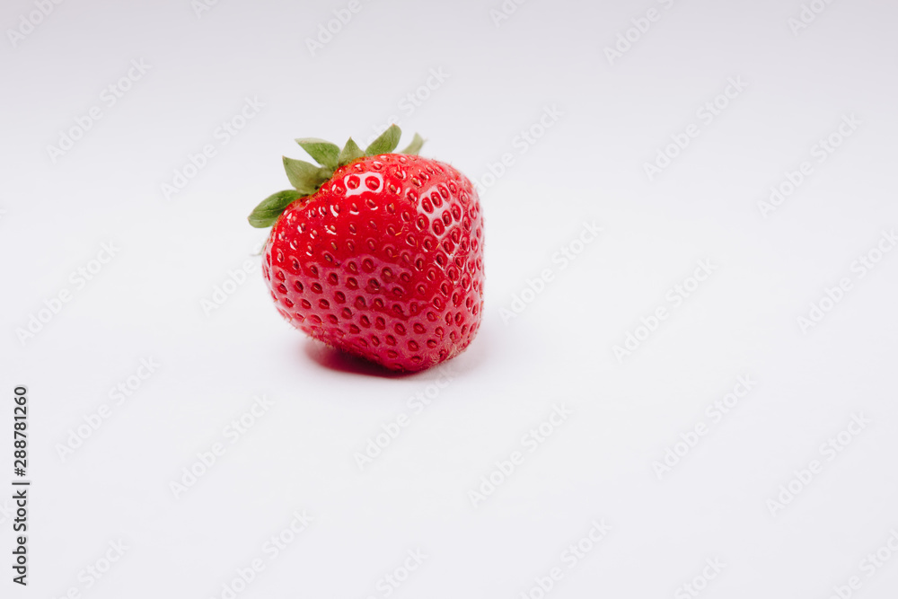 red tasty strawberries on a white background red tasty strawberries on a white background
