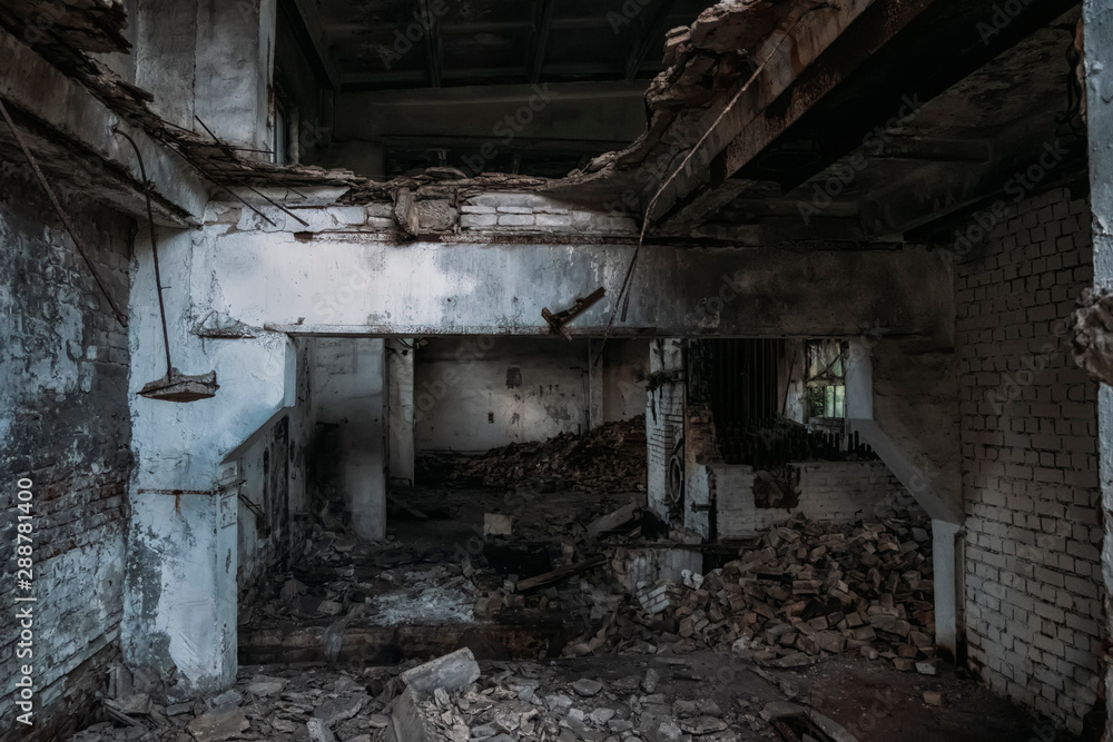 Old abandoned broken ruined industrial building interior