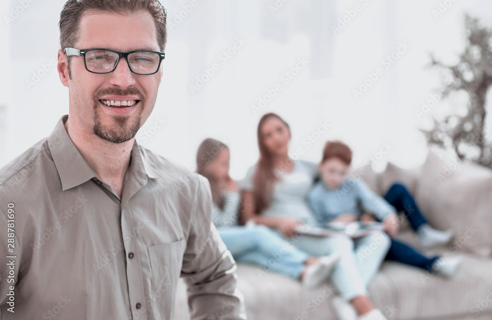 successful man standing in his living room. successful man standing in his living room.