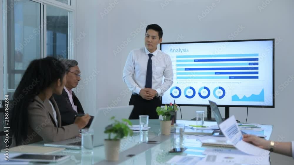 Business concept. Young men presenting results at the meeting. 4k Resolution. Business concept. Young men presenting results at the meeting. 4k Resolution.