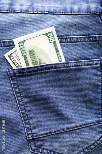 USA Dollars in a jeans pocket, closeup.