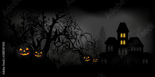Halloween night with candles, pumpkins and haunted house in a mysterious forest