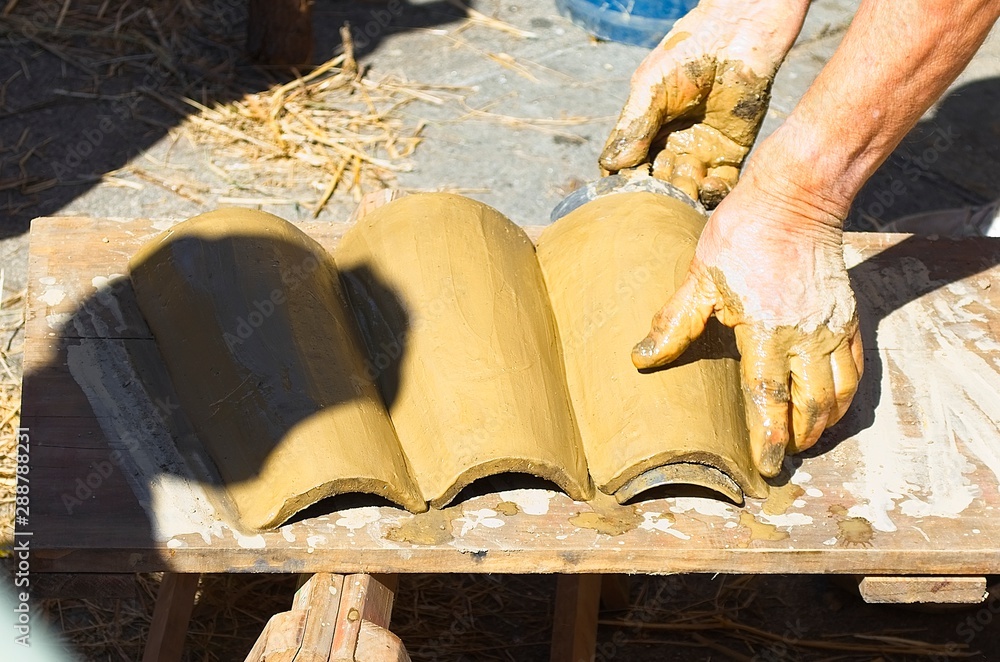 Clay roof tile craftsmen at Feira Franca medieval party Clay roof tile craftsmen at Feira Franca medieval party