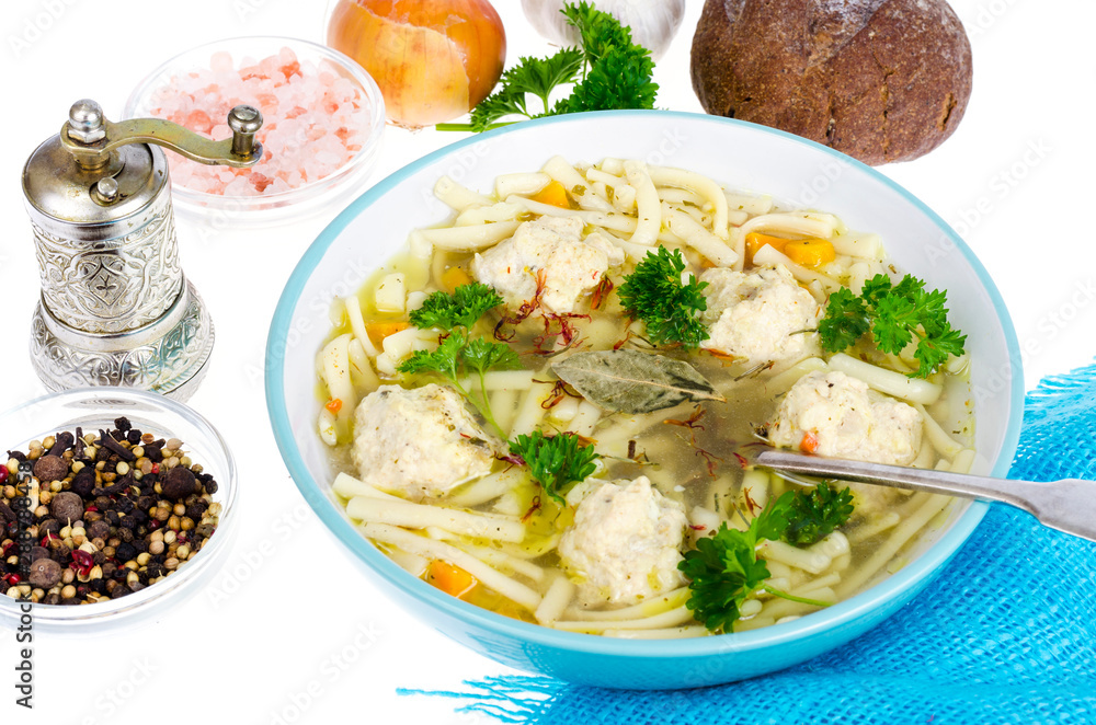 Chicken broth with egg noodles and meatballs. Chicken broth with egg noodles and meatballs.