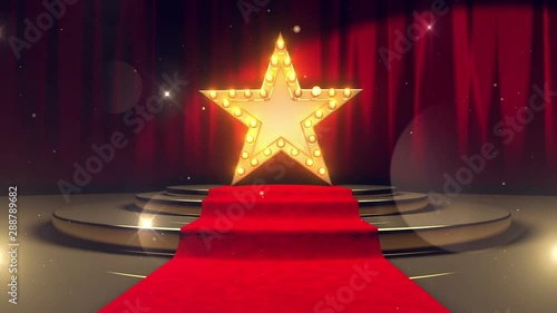 golden star with light bulbs on red velvet curtain on stage