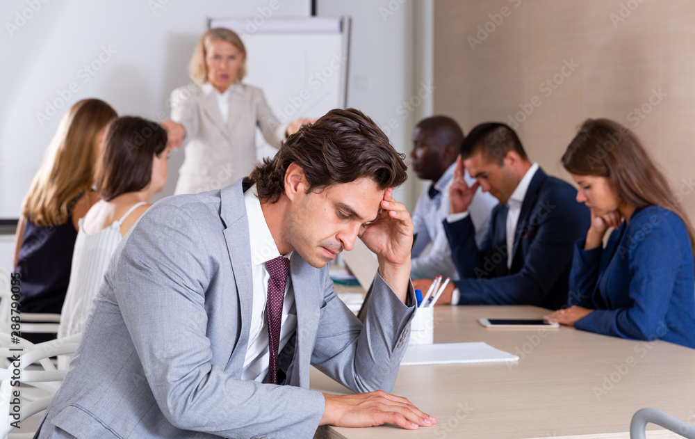 Fototapeta premium Upset male office worker on meeting