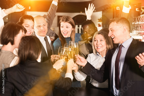 Bilde på lerret Colleagues clinking glasses of champagne on corporate party