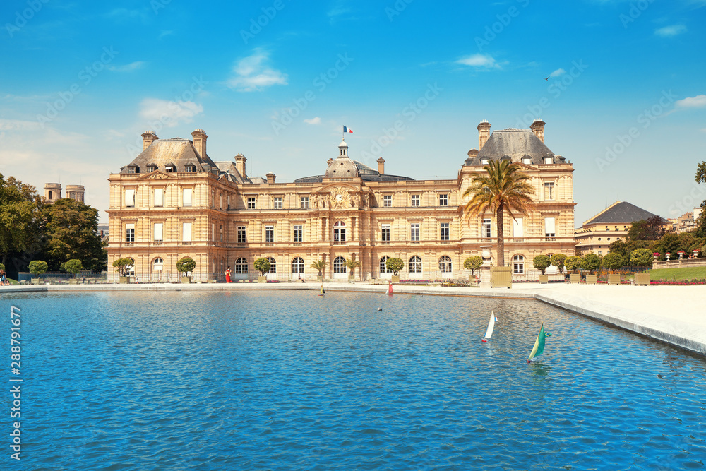 26 July 2019, Paris, France: Luxembourg Palace in The Jardin du Luxembourg. View with pond with small boats