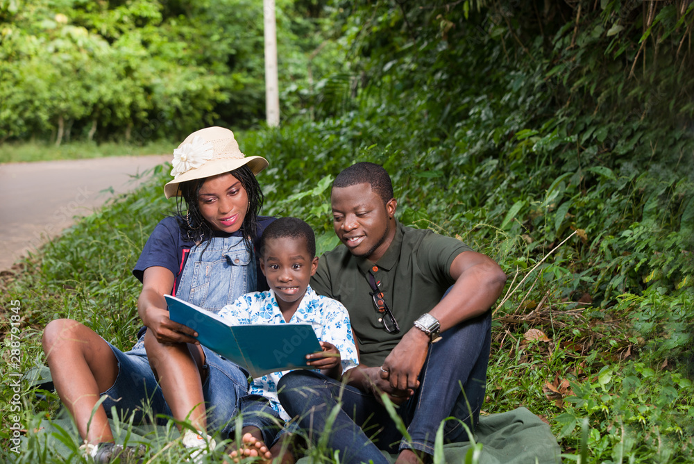 a happy family during an outing, relaxing. a happy family during an outing, relaxing.