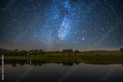 The river at night against the background of the starry sky