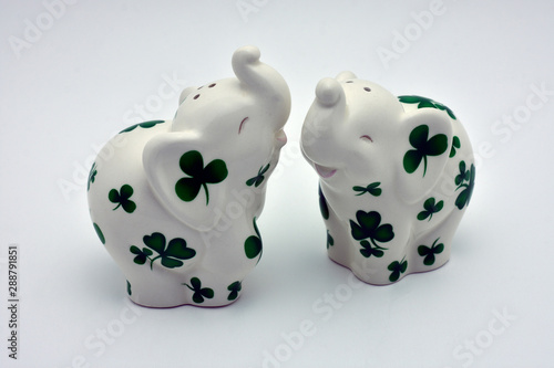 white elephants with green clovers salt and pepper shakers