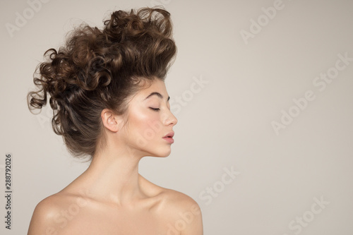 Young woman portrait. Creative hairstyle.