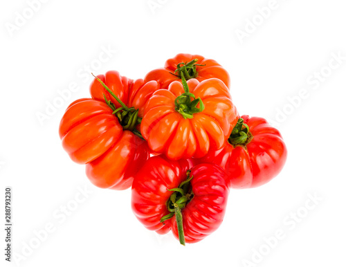 Red fresh beefsteak tomatoes on white background.
