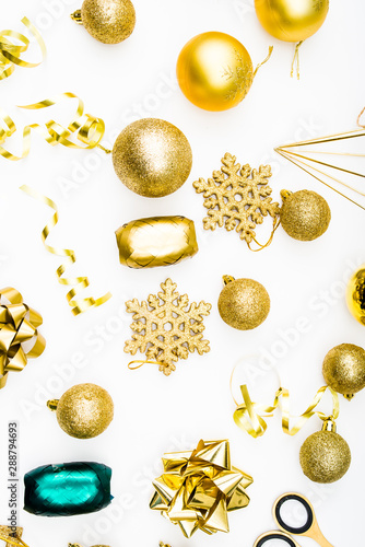 Christmas composition of ribbons,golden diy items scissor and christmas decoration tools,empty copy space for text. holiday and celebration concept for postcard or invitation. Flat lay, top view