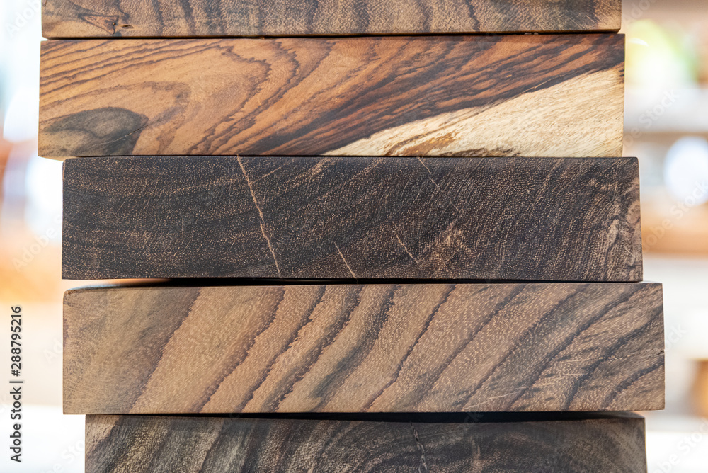close up of wooden chopping boards in a stack on a shelf close up of wooden chopping boards in a stack on a shelf