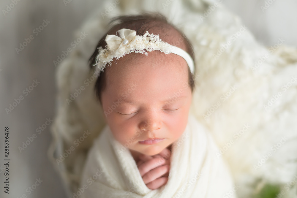 first photo shoot. newborn child. newborn. the child lies in white . newborn girl first photo shoot. newborn child. newborn. the child lies in white . newborn girl