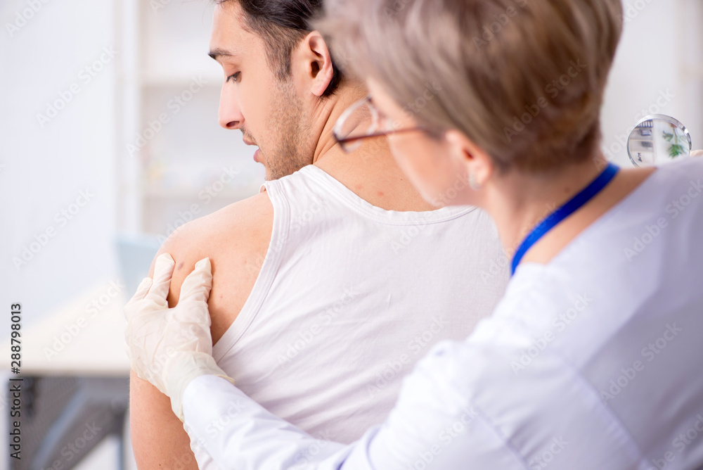 Fototapeta premium Young patient visiting doctor in hospital