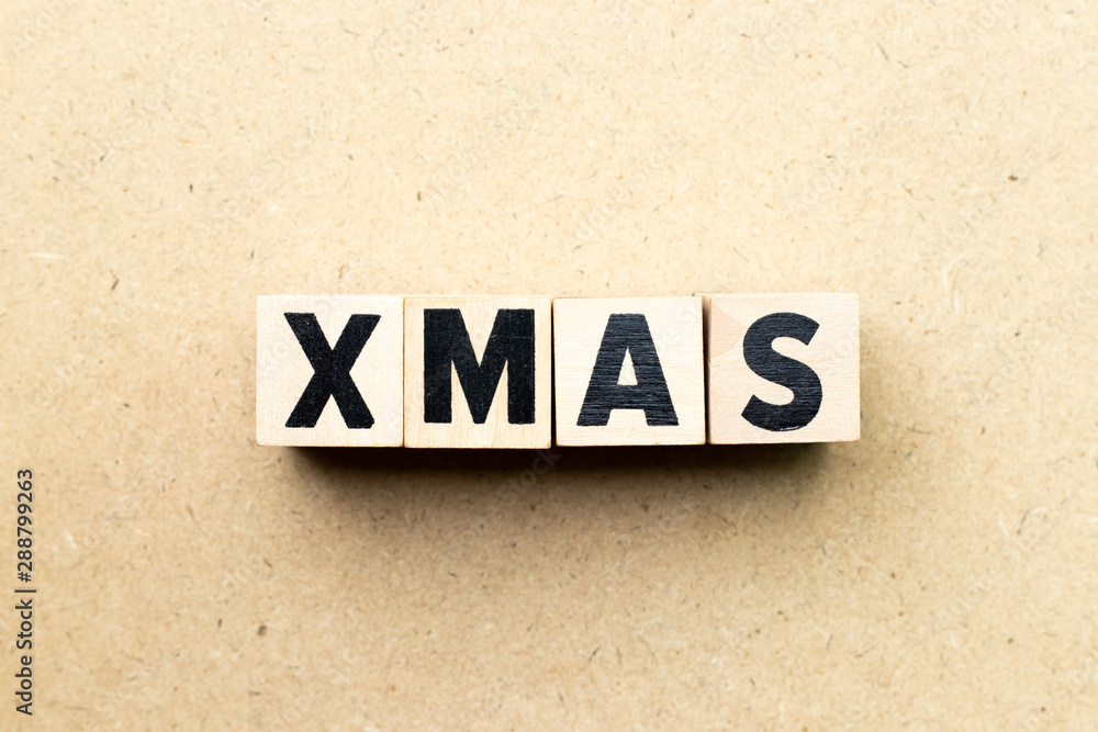 Obraz premium Letter block in word xmas on wood background (Concept for Christmas)