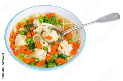 Chicken broth with vegetables, pasta and meatballs.